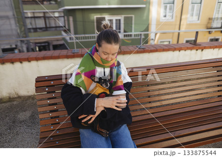 Outdoor city scene featuring cheerful woman and vibrant surroundings Outdoor city scene featuring cheerful woman and vibrant surroundings 133875544