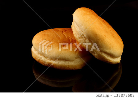 Yellow burger bread isolated on black background 133875605