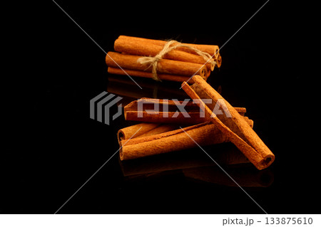cinnamon sticks isolated on black background cinnamon sticks isolated on black background 133875610