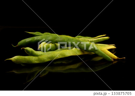 Green string beans on a black background. Healthy organic food collection. Copy Space for Text. Green string beans on a black background. Healthy organic food collection. Copy Space for Text. 133875705
