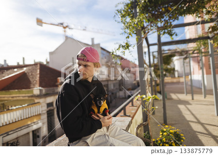 Musician finds serenity among city streets and bright rays Musician finds serenity among city streets and bright rays 133875779