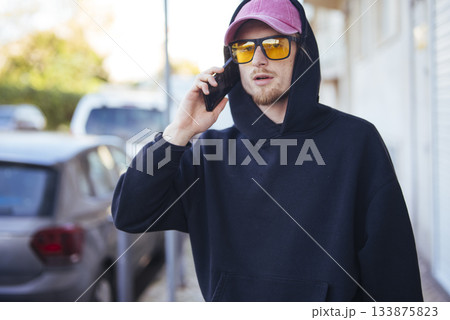 Vibrant city youth expressing personal style while communicating on go 133875823