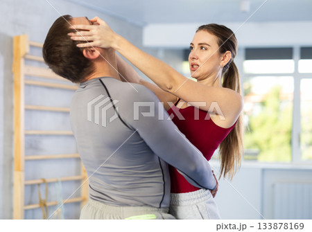 Woman and man practicing self defense techniques 133878169