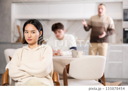 Adult and young man quarreling with woman Adult and young man quarreling with woman 133878454