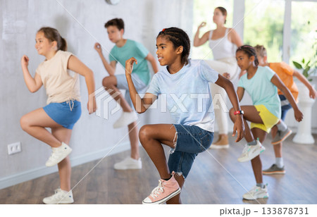 Smiling african american preteen boy practicing vigorous dance 133878731