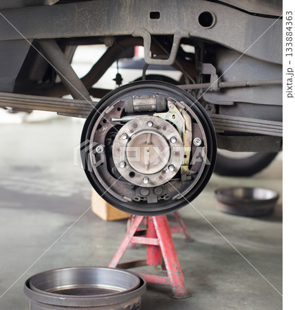 Pickup truck replace drum brake shoes of rear axle. Pickup truck replace drum brake shoes of rear axle. 133884363