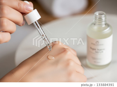 woman applying cream on her face 133884391