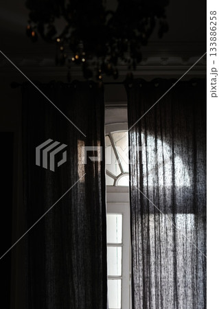 Beautiful view from retro window. Light from window to the dark room. 133886258