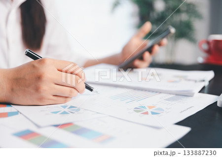 Business woman analyze calculate company financial, tax results office accounting statistics analytical research. calculating business balance prepare tax reduction. Tax deduction planning concept. 133887230