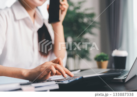 Business woman analyze calculate company financial, tax results office accounting statistics analytical research. calculating business balance prepare tax reduction. Tax deduction planning concept. Business woman analyze calculate company financial, tax results office accounting statistics analytical research. calculating business balance prepare tax reduction. Tax deduction planning concept. 133887338