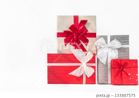 Red gift box with red bow on white background. Holiday greeting card 133887575