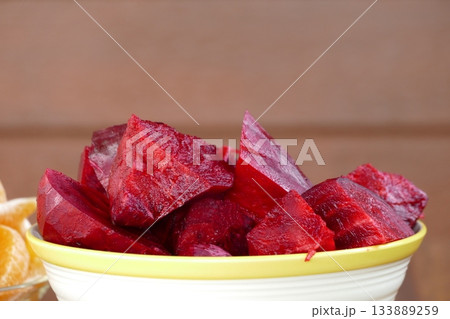 Slices of beetroot in a white bowl 133889259
