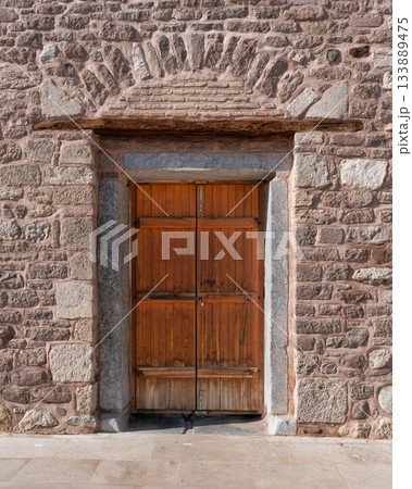 Rustic wooden door and textured stone wall of Alaeddin Mosque, Konya, Turkey Rustic wooden door and textured stone wall of Alaeddin Mosque, Konya, Turkey 133889475