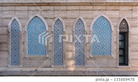 Exterior wall with intricate Islamic tile patterns and arches at War of Independence Martyrs' Monument, Konya, Turkey. Exterior wall with intricate Islamic tile patterns and arches at War of Independence Martyrs' Monument, Konya, Turkey. 133889478