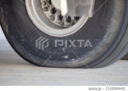 Close-up of landing gear tire and wheel hub 133890448