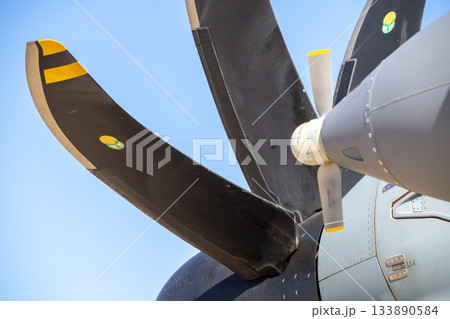 Propeller blades of turboprop engine against blue sky Propeller blades of turboprop engine against blue sky 133890584