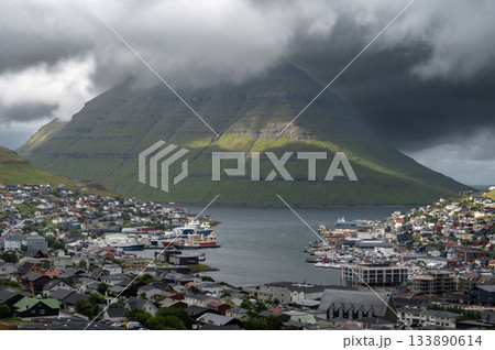 Breathtaking panoramic view of Klaksvik city, nestled among fjords and mountains in the Faroe Islands, Denmark, North Atlantic. Breathtaking panoramic view of Klaksvik city, nestled among fjords and mountains in the Faroe Islands, Denmark, North Atlantic. 133890614