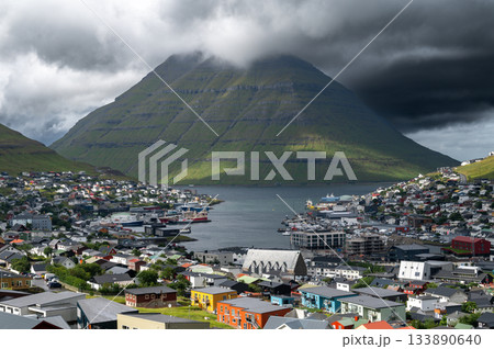 Breathtaking panoramic view of Klaksvik city, nestled among fjords and mountains in the Faroe Islands, Denmark, North Atlantic. Breathtaking panoramic view of Klaksvik city, nestled among fjords and mountains in the Faroe Islands, Denmark, North Atlantic. 133890640