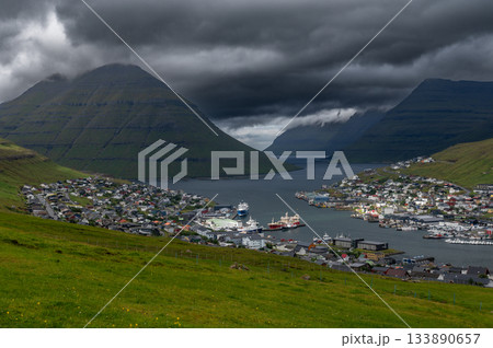 Breathtaking panoramic view of Klaksvik city, nestled among fjords and mountains in the Faroe Islands, Denmark, North Atlantic. Breathtaking panoramic view of Klaksvik city, nestled among fjords and mountains in the Faroe Islands, Denmark, North Atlantic. 133890657
