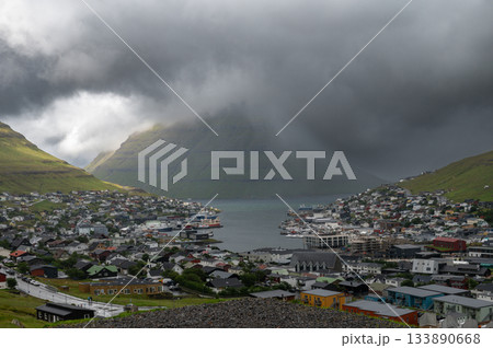 Breathtaking panoramic view of Klaksvik city, nestled among fjords and mountains in the Faroe Islands, Denmark, North Atlantic. Breathtaking panoramic view of Klaksvik city, nestled among fjords and mountains in the Faroe Islands, Denmark, North Atlantic. 133890668