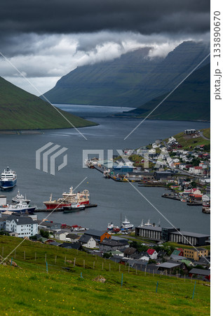 Breathtaking panoramic view of Klaksvik city, nestled among fjords and mountains in the Faroe Islands, Denmark, North Atlantic. 133890670