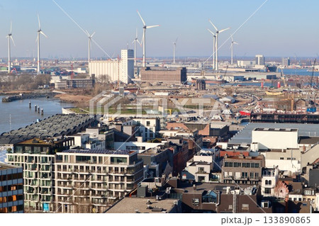 Antwerp cityscape and port with wind turbines harnessing sustainable energy, combining urban development and green technology Antwerp cityscape and port with wind turbines harnessing sustainable energy, combining urban development and green technology 133890865