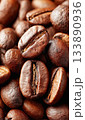 Roasted coffee beans creating background texture pattern 133890936