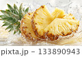 Sliced pineapple fruit splashing in fresh clear water 133890943