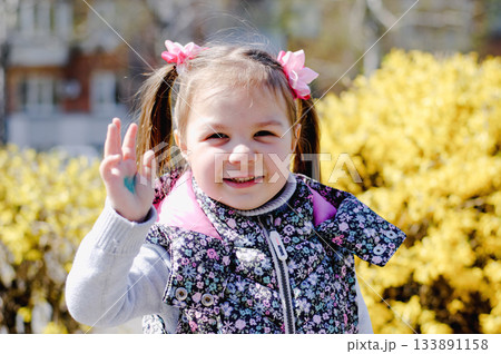 Cute Adorable Toddler Having Fun Times and Adventures at the Local Neighborhood Playground. Healthy happy baby child playing in the park. Stylish clothes for kids 133891158