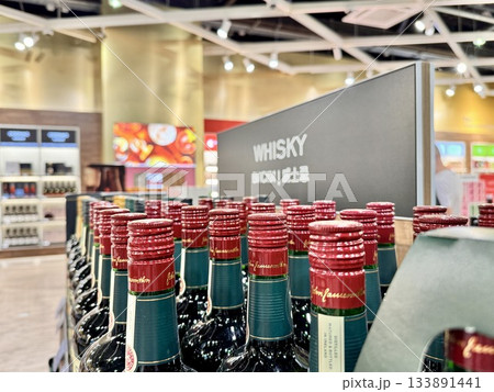 Alcoholic drinks are on the shop window in duty free 133891441