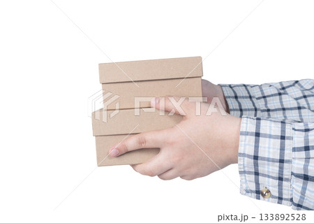 Hands of delivery man holding boxes isolated on white background. High quality photo Hands of delivery man holding boxes isolated on white background. High quality photo 133892528