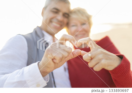 Senior couple hands forming heart shape expressing love 133893697