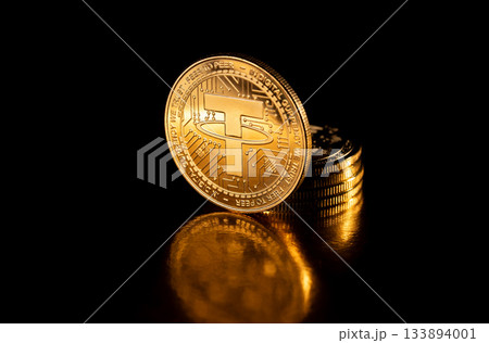 Tether USDT coin on black. 133894001