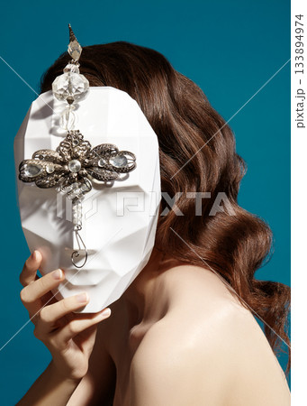 Beautiful Woman Wearing Mask. Mysterious Girl with Nice Masquerade Accessories. Carnival, Halloween or Christmas Style Beautiful Woman Wearing Mask. Mysterious Girl with Nice Masquerade Accessories. Carnival, Halloween or Christmas Style 133894974