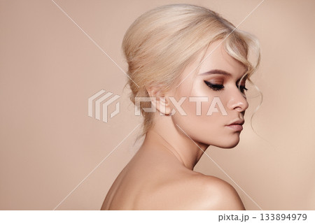 Sexy blond woman in retro style. Beautiful woman model in femininity pose with fashion make-up, soft skin, hairstyle Sexy blond woman in retro style. Beautiful woman model in femininity pose with fashion make-up, soft skin, hairstyle 133894979