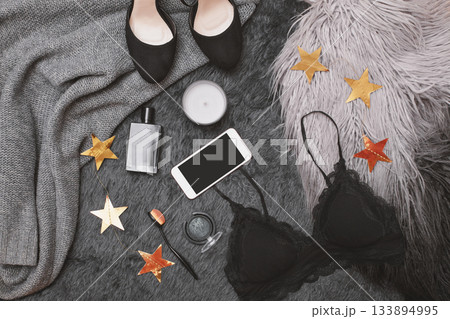 Hand use Mobile on Fashion Apparel. Top View with Woman Accessories. Trendy Clothing with Online Payments on Cell Tech 133894995