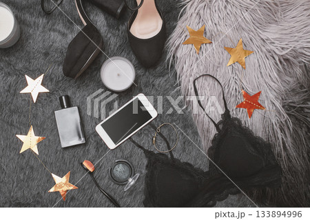 Hand use Mobile on Fashion Apparel. Top View with Woman Accessories. Trendy Clothing with Online Payments on Cell Tech Hand use Mobile on Fashion Apparel. Top View with Woman Accessories. Trendy Clothing with Online Payments on Cell Tech 133894996