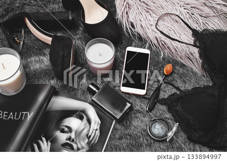 Hand use Mobile on Fashion Apparel. Top View with Woman Accessories. Trendy Clothing with Online Payments on Cell Tech 133894997