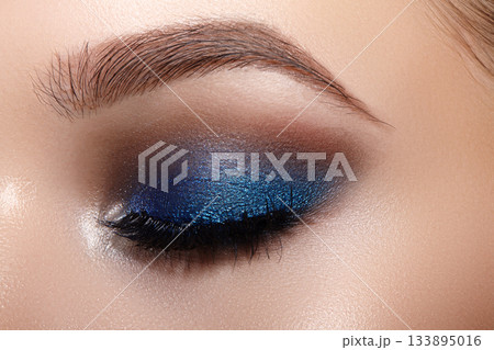 Closeup Macro of Woman Face with Blue Eyes Make-up. Fashion Celebrate Makeup, Glowy Clean Skin, perfect Shapes of Brows 133895016