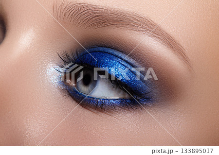 Closeup Macro of Woman Face with Blue Eyes Make-up. Fashion Celebrate Makeup, Glowy Clean Skin, perfect Shapes of Brows 133895017