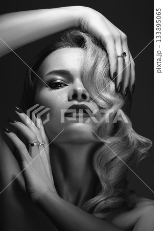 Beautiful Woman with Fashion Make-up and Blond Wave Hairstyle. Glamour American Diva Style with Brilliant Accessories Beautiful Woman with Fashion Make-up and Blond Wave Hairstyle. Glamour American Diva Style with Brilliant Accessories 133895065