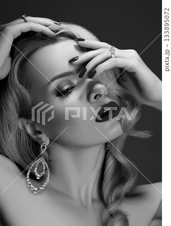 Beautiful Woman with Fashion Make-up and Blond Wave Hairstyle. Glamour American Diva Style with Brilliant Accessories Beautiful Woman with Fashion Make-up and Blond Wave Hairstyle. Glamour American Diva Style with Brilliant Accessories 133895072