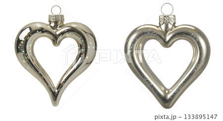 Elegant silver heart-shaped ornaments for christmas or wedding decor, reflecting light on transparent background for festive concepts 133895147
