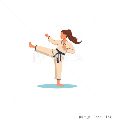 Focused woman practices karate kick technique with determined expression and disciplined movements 133898173