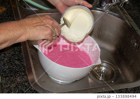 Woman making a quark cake 133898494
