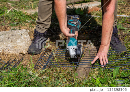 Grinding a fence with a grinding machine 133898506