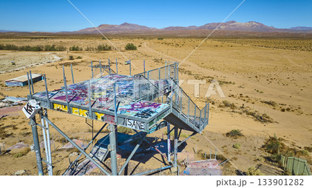 Aerial Abandoned Graffiti Covered Water Park Platform in California Desert Aerial Abandoned Graffiti Covered Water Park Platform in California Desert 133901282