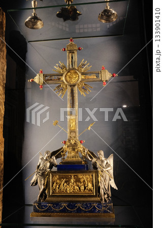 Treasury reliquaries at Basilica of the Holy Cross in Jerusalem Rome gold monstrance cross and sacred vessels in glass display case museum interior editorial use only. High quality photo 133901410