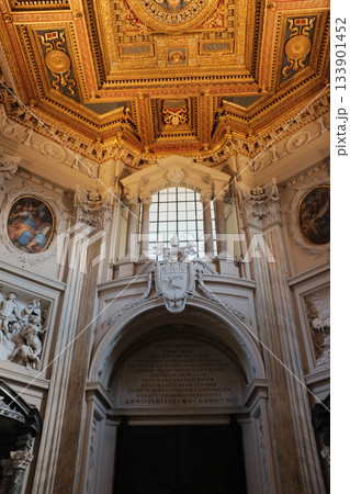 Archbasilica of Saint John Lateran Rome exterior facade and grand baroque interior with golden coffered ceiling vast nave marble statues side chapels ornate altar apse and dome Catholic basilica Archbasilica of Saint John Lateran Rome exterior facade and grand baroque interior with golden coffered ceiling vast nave marble statues side chapels ornate altar apse and dome Catholic basilica 133901452