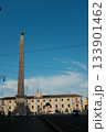 Lateran Obelisk in Piazza San Giovanni in Laterano Rome under blue sky ancient Egyptian granite monument with Latin base inscriptions city square landmark travel Italy. High quality photo 133901462